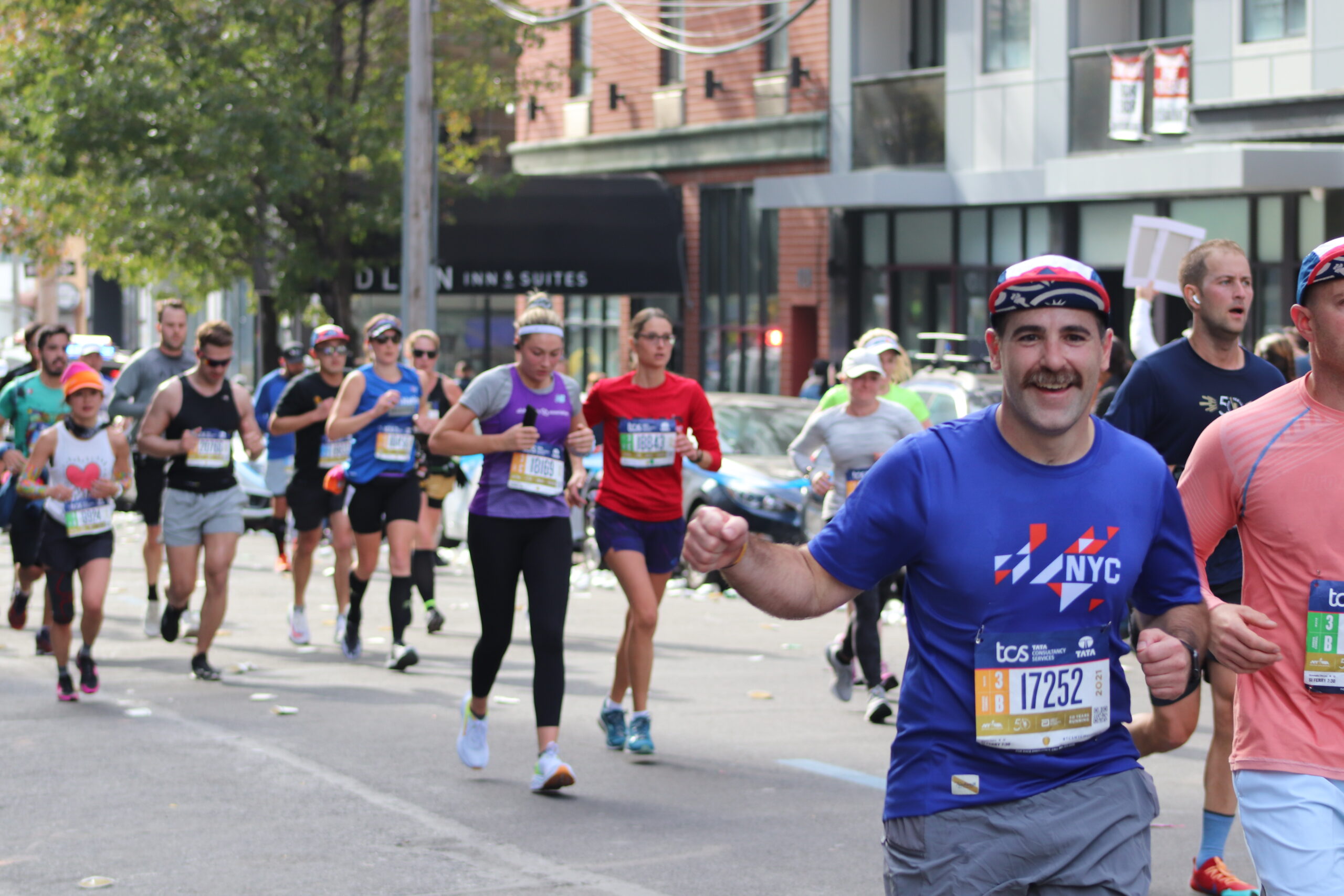 Runners at the Queens section of the New York City marathon route (Photo by Michael Dorgan, The Long Hall Podcast)