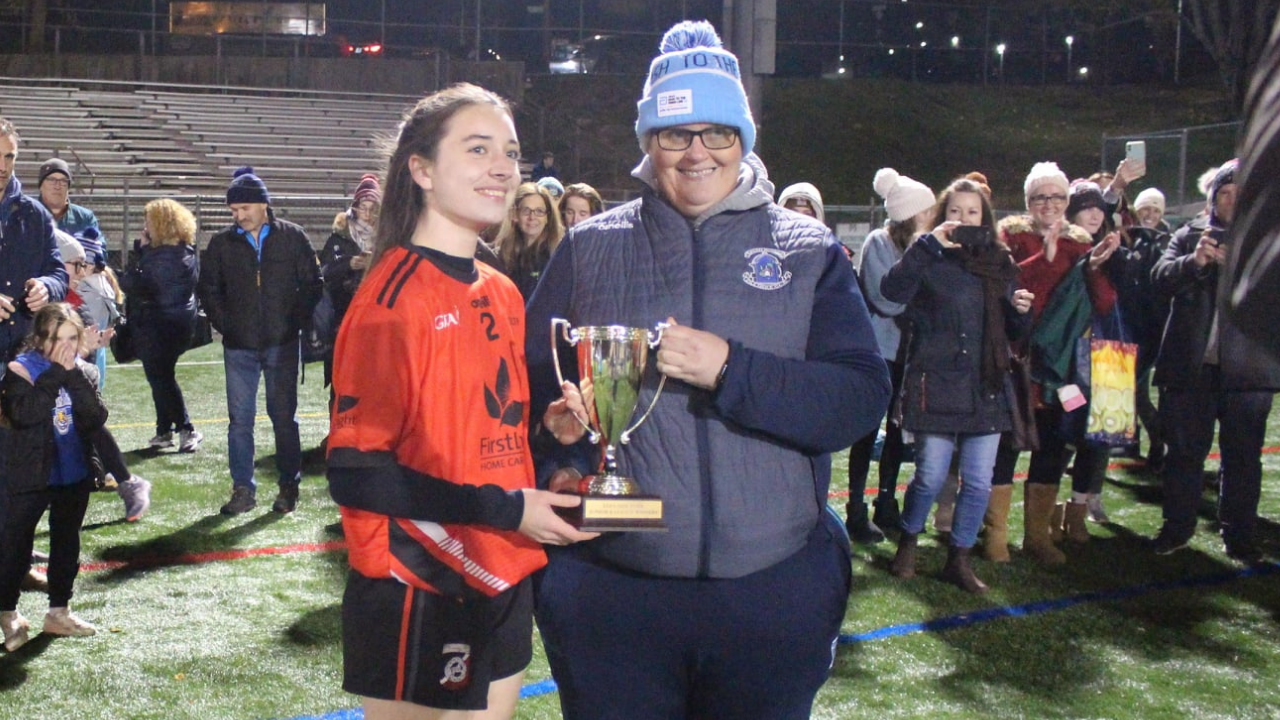 Chairperson Nollaig Cleary presents the cup to Celtanta captain Orlaith Gallagher (Photo by Pete Dwyer)