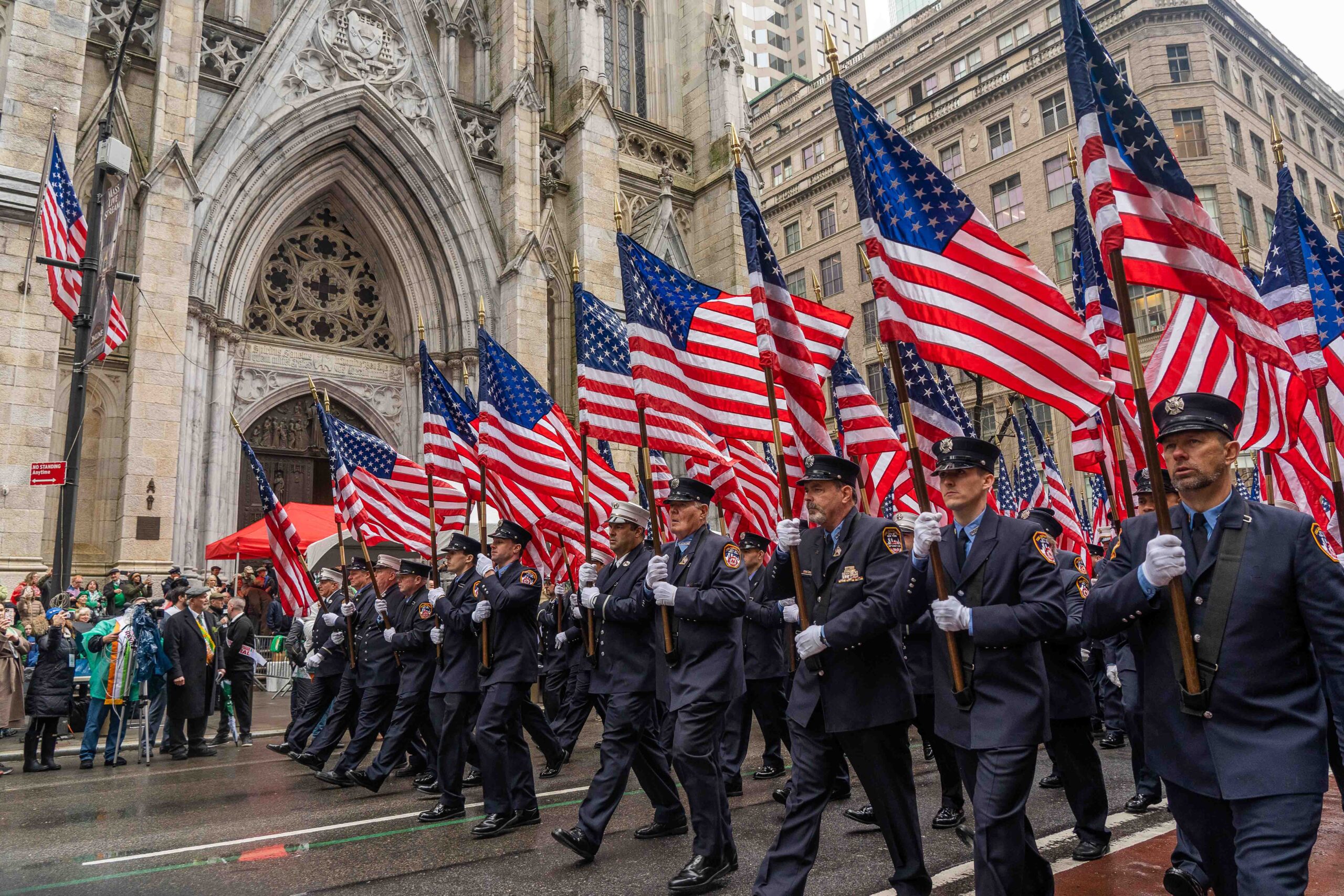 FDNY members marching in the New York City St. Patrick's Day Parade along Fifth Avenue in Manhattan.