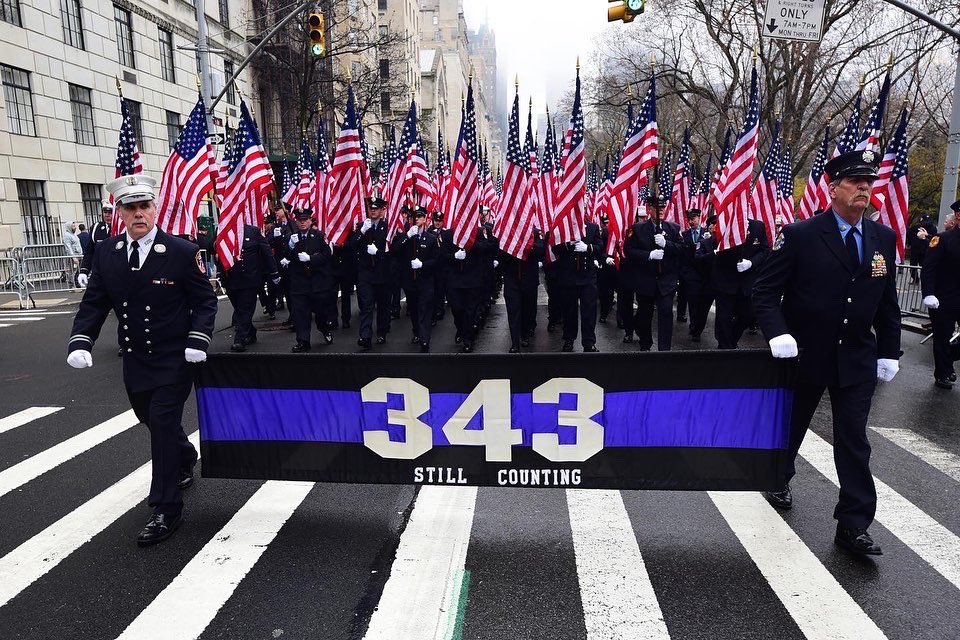 FDNY members pause in front of Saint Patrick’s Cathedral to pay tribute to to those who died on 9/11